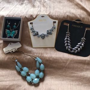 Four different pieces of fashion jewelry